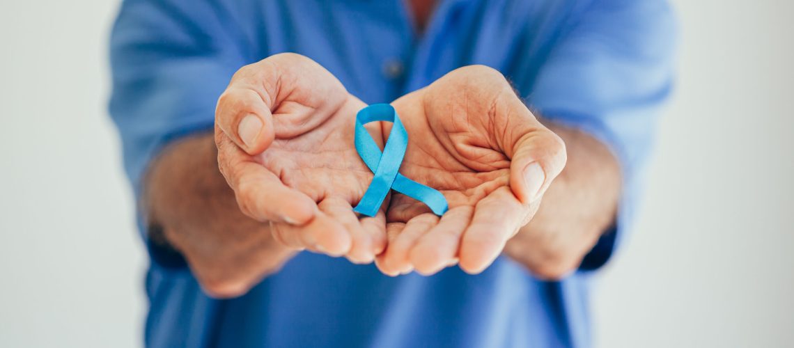 Prostate Cancer Awareness. Man with light Blue Ribbon for supporting people living and illness. Men Healthcare and World cancer day concept